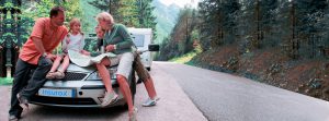 Travel - family with camping car on the road